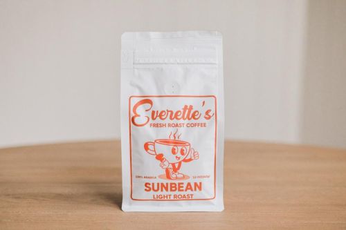 Front of Everette’s Fresh Roast Coffee Sunbean Light Roast 12oz bag on wooden table
