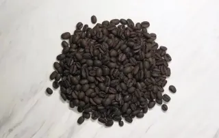 glory-cloud-decaf-coffee-beans-top-view-12oz-unsung-roasters Top view of Glory Cloud Decaf Coffee beans – Swiss Water decaf coffee by Unsung Roasters