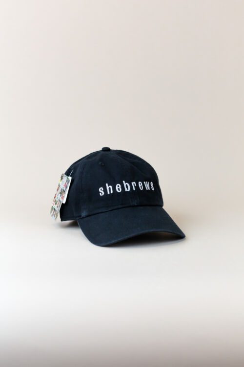 Black SheBrews Coffee Roasters hat with embroidered logo, front angle