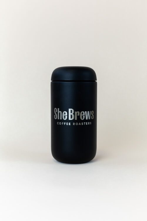 Matte Black She Brews Coffee Roasters canister with silver logo