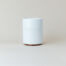 White ceramic coffee mug with cork base and She Brews Coffee Roasters logo