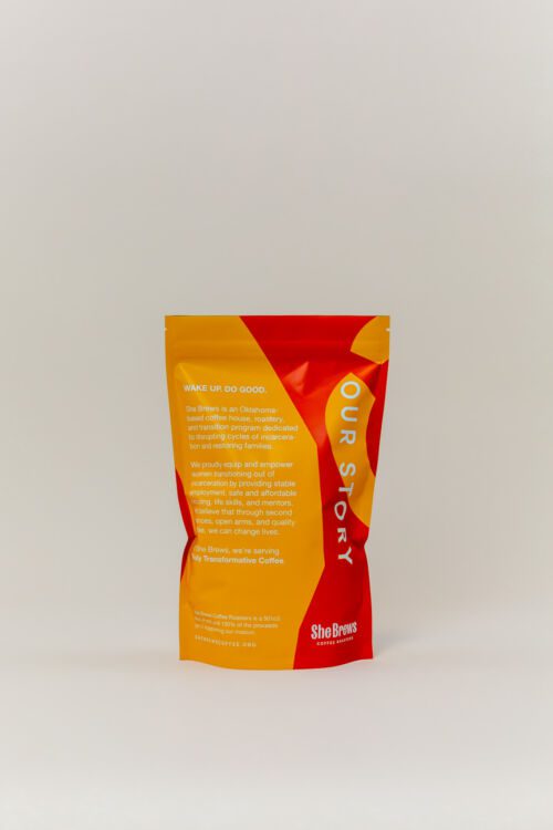 Back of the 12oz She Brews Peacemaker coffee bag highlighting the company’s mission and social impact
