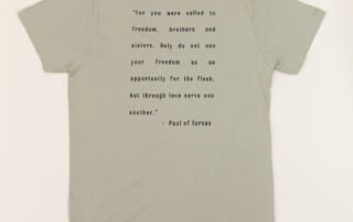 Back of sage green She Brews t-shirt with inspirational Paul of Tarsus quote printed in black