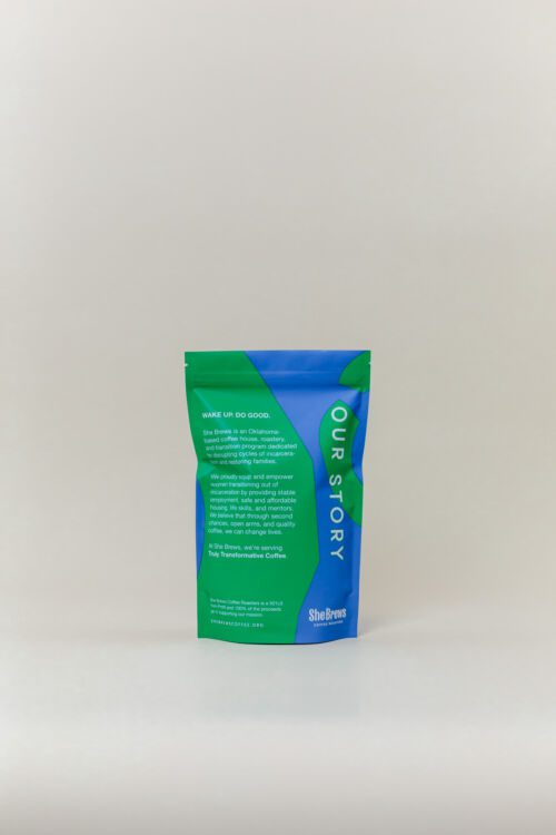 Back of She Brews Sheland Blend 12oz coffee bag showing brand story and mission