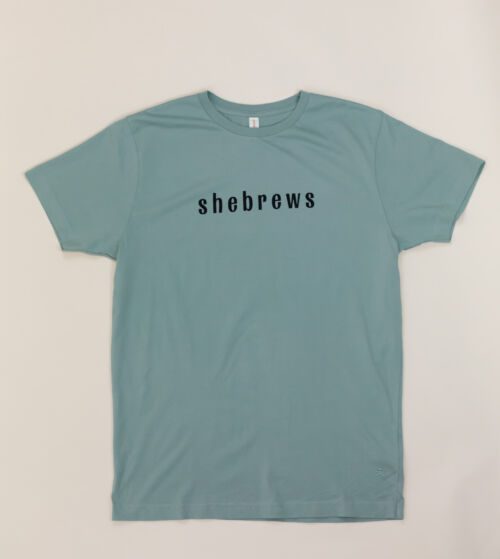 Front of teal She Brews t-shirt with minimalist “shebrews” text