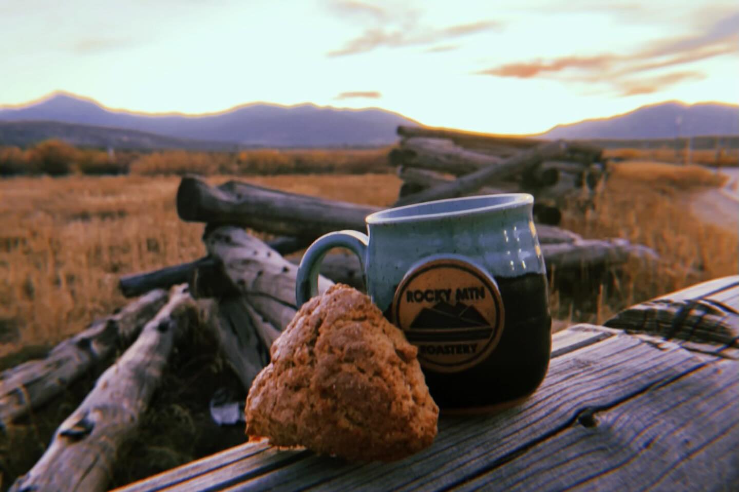 Rocky Mountain Roastery coffee and fresh scone at sunrise showcasing artisanal small-batch brewing experience