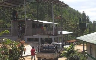 kith-kin-brazil-coffee-washing-station-facility-truck-unsung-roasters. Coffee processing facility in Brazil with a Toyota truck and workers on-site.