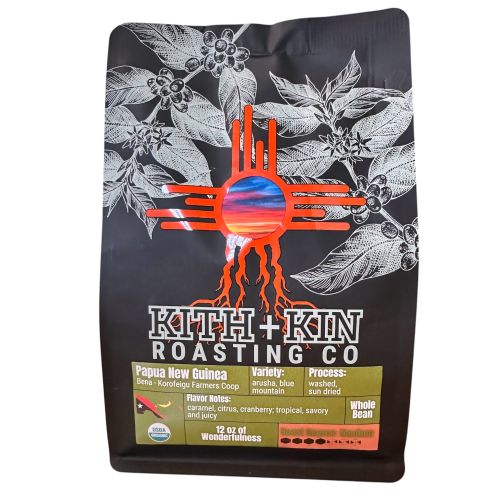 Kith + Kin Papua New Guinea coffee bag with green label, medium roast, and origin details.